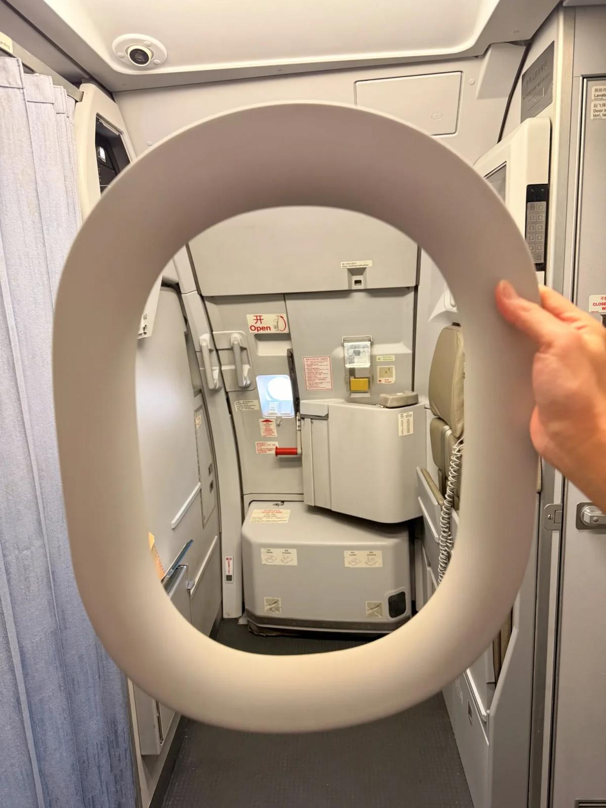 Unflappable Passenger Hands Falling Window to Crew