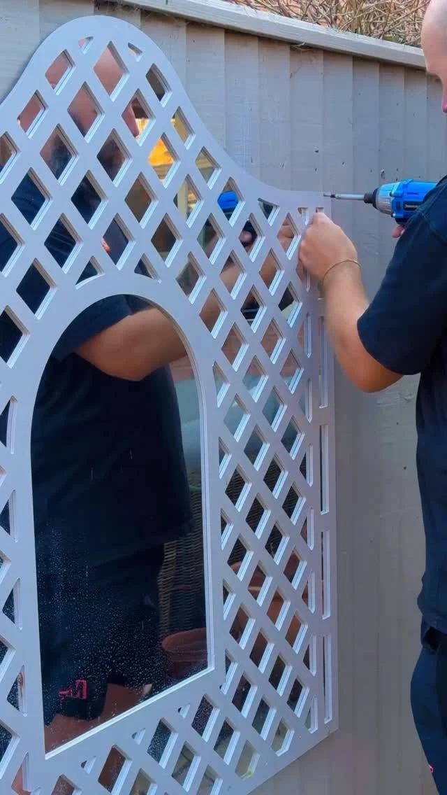 Mirrored Panels Turn Boring Fences Into Garden Highlights