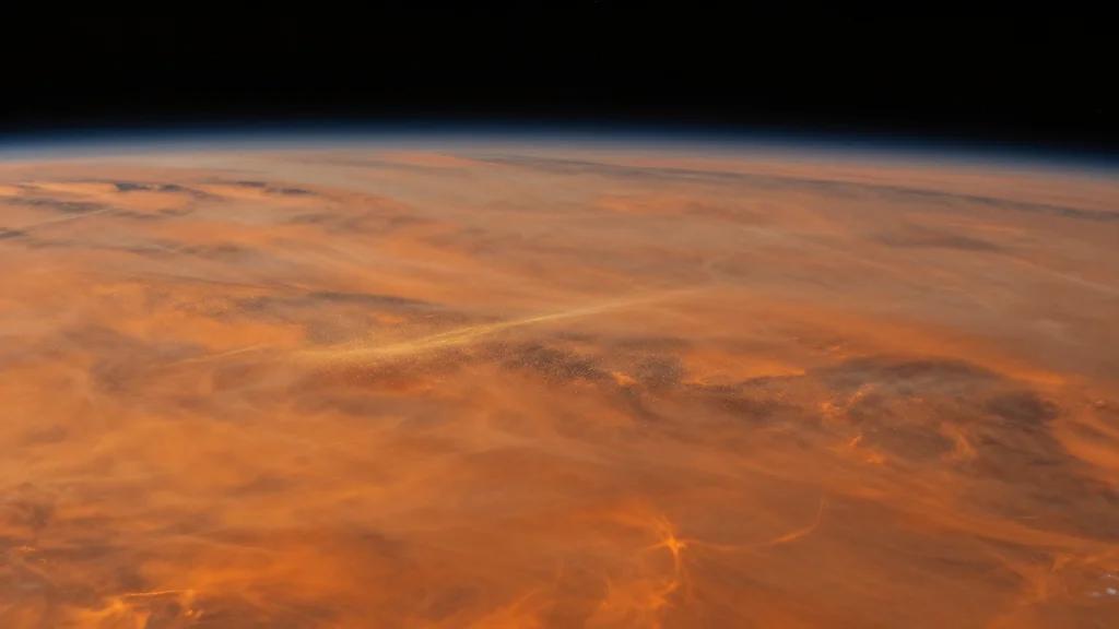 Cosmic Dust Identified as the Source of Venus's Enigmatic Lower Haze